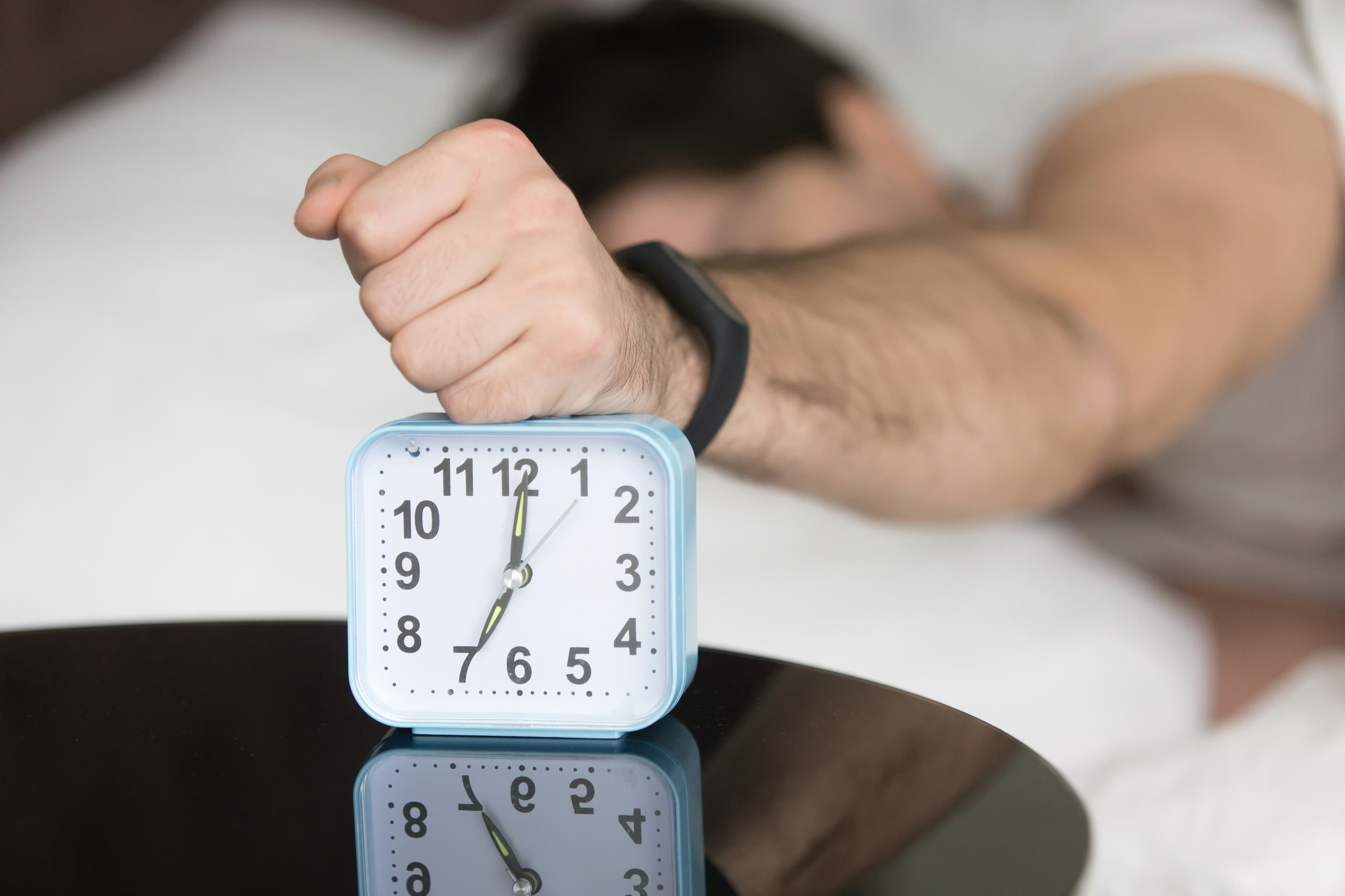 Person tired in the morning representing accumulated sleep debt