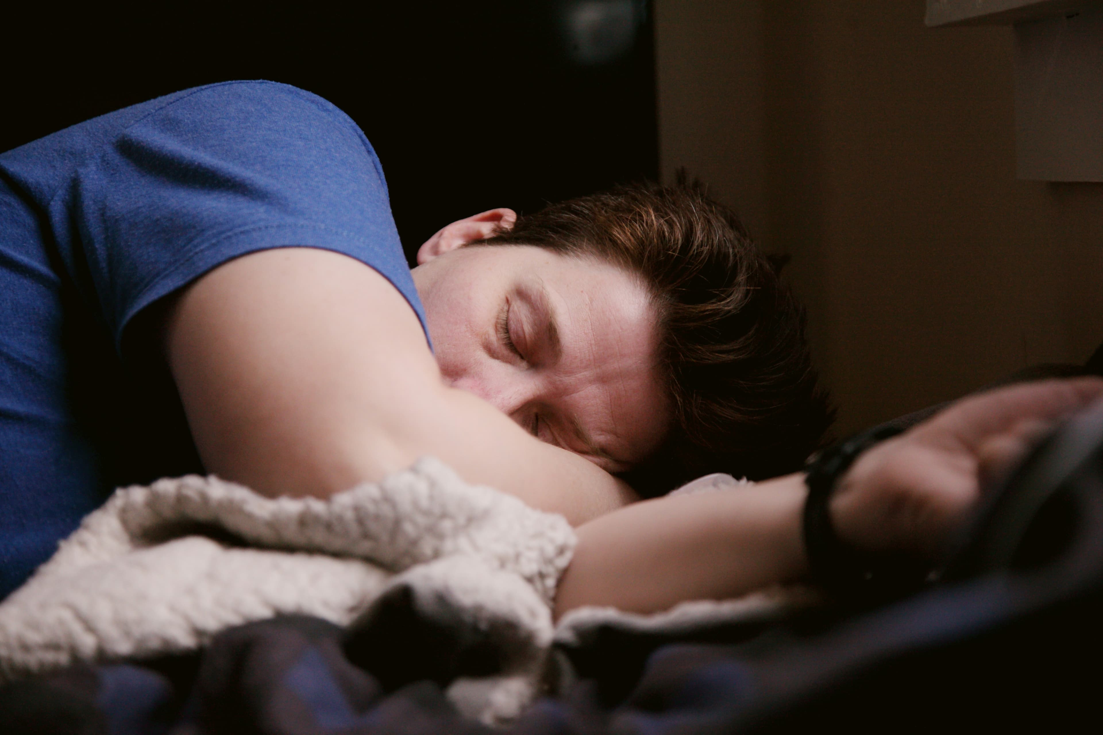 Person sleeping peacefully at night representing recovery quality
